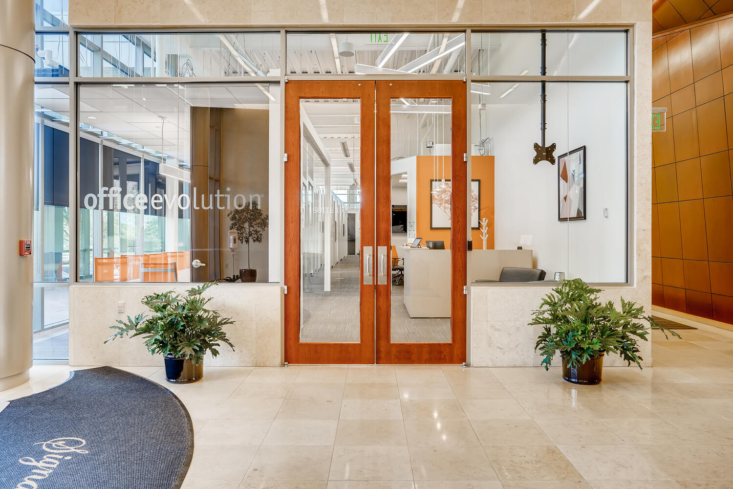 office evolution coworking franchise glass door