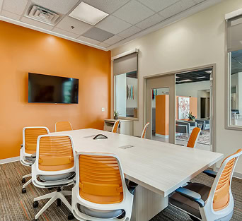 Office Evolution franchising office in Spain with modern meeting room and workspace.