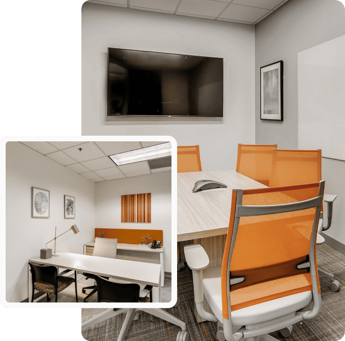 Modern office meeting room with orange chairs, a large TV, and whiteboard, ideal for business discussions and franchise meetings.
