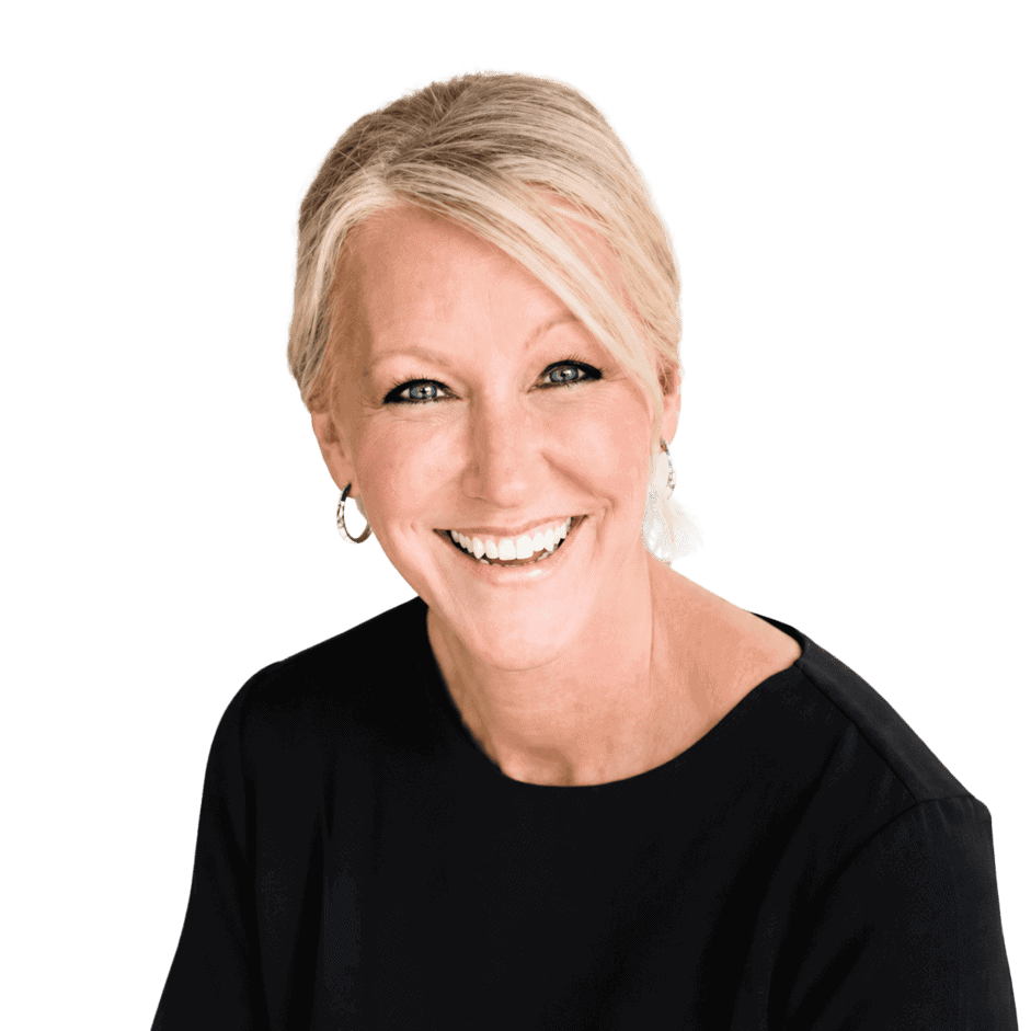 Smiling woman with short blonde hair wearing a black top, representing professional office environment and franchise success.