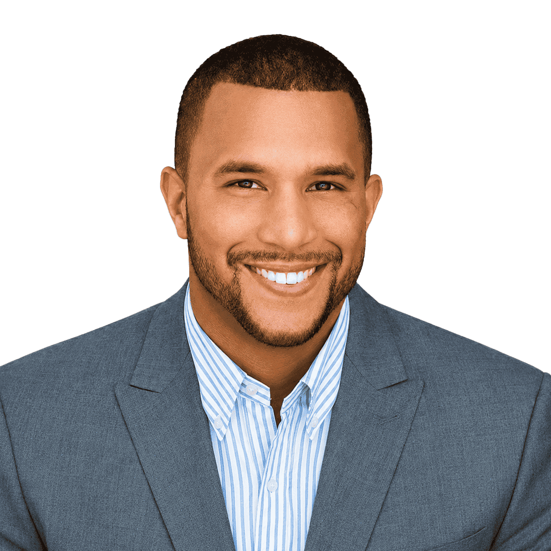 Professional man in a blue suit smiling, representing office and business success.