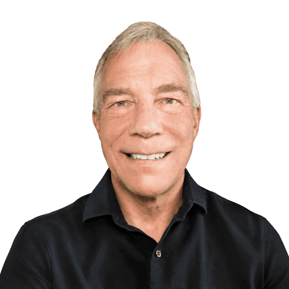 Smiling mature man in black shirt, representing Office Evolution franchise opportunities and professional workspace solutions.